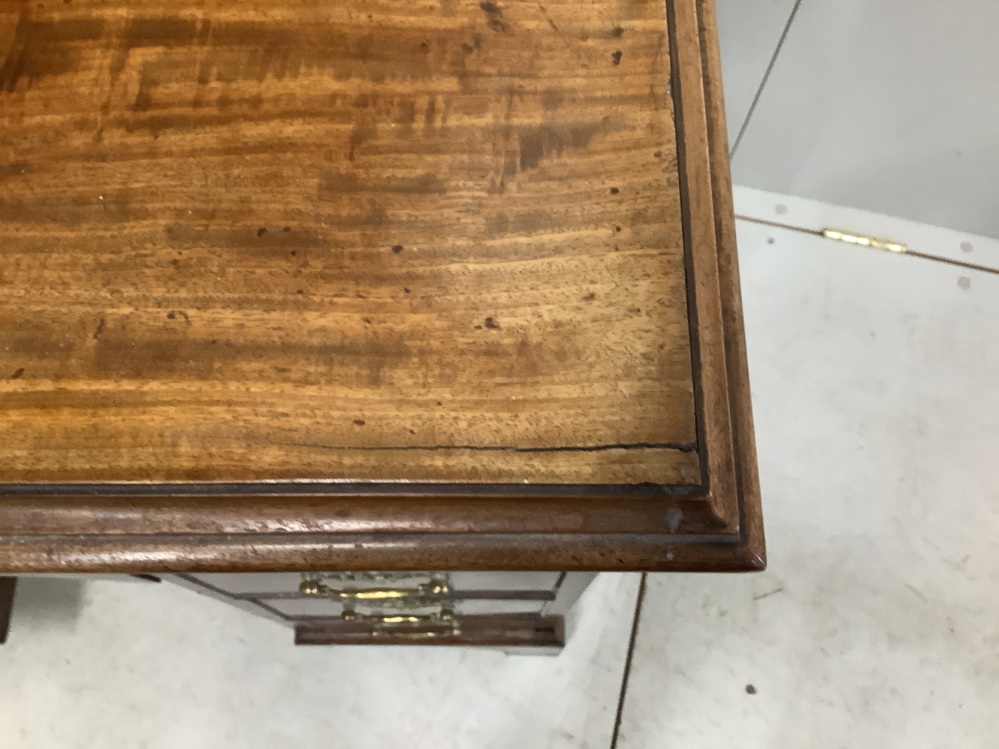 A George III and later mahogany kneehole desk with secretaire drawer, width 85cm, depth 52cm, height 92cm